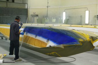 The blue and gold stripes are painted to match the aircraft.
